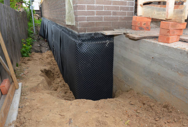 Happy homeowners after waterproofing job in Mosherville